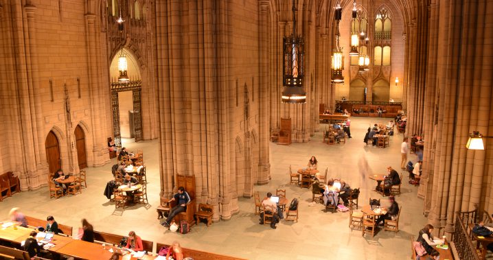 Students studying in the Cathedral Commons room from above
